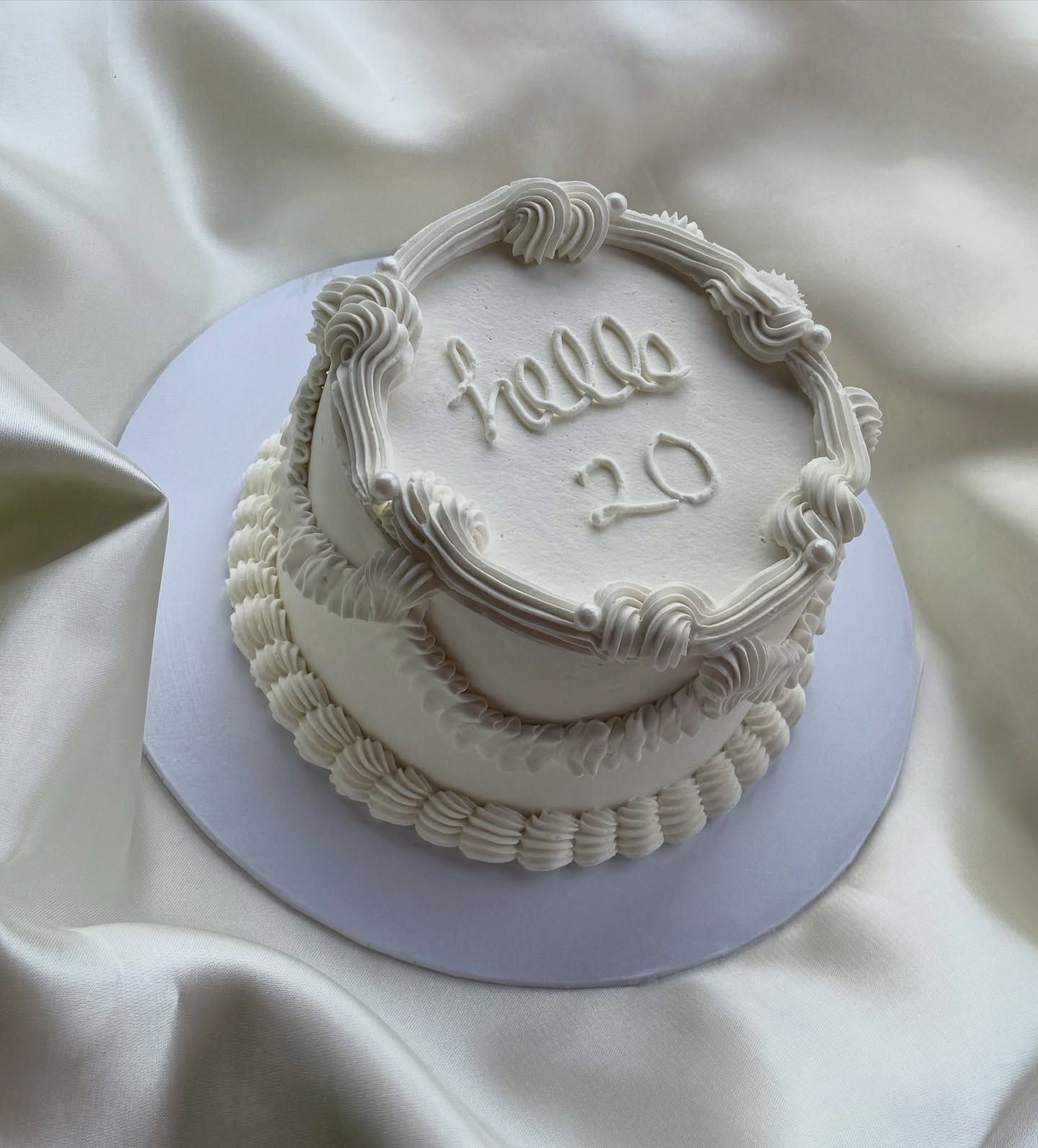 Elegant ivory wreath celebration cake