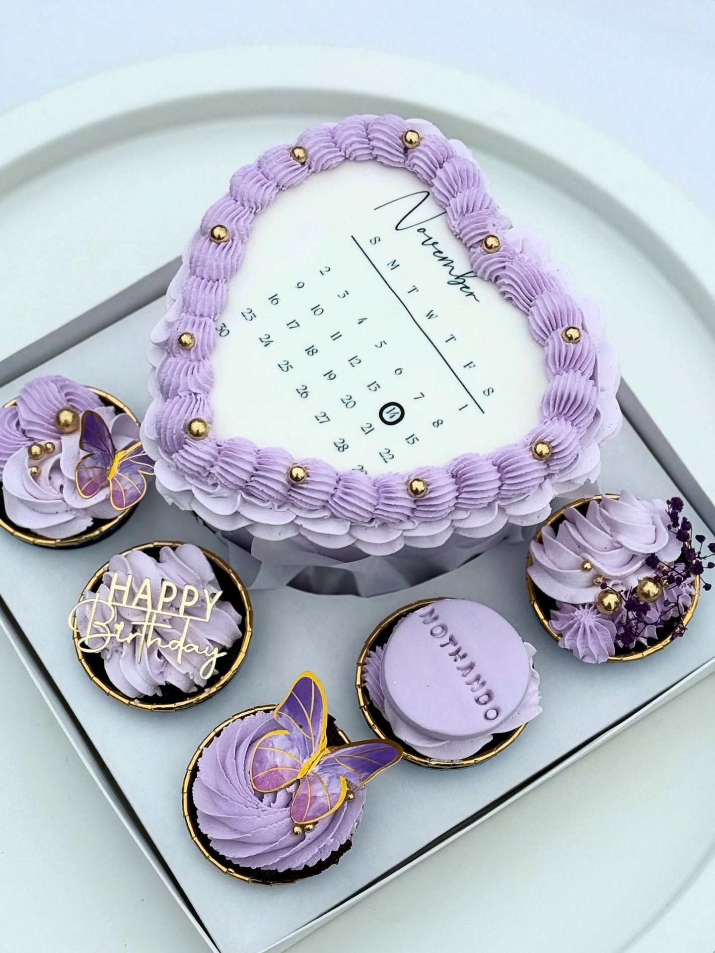 A lilac heart-shaped celebration cake