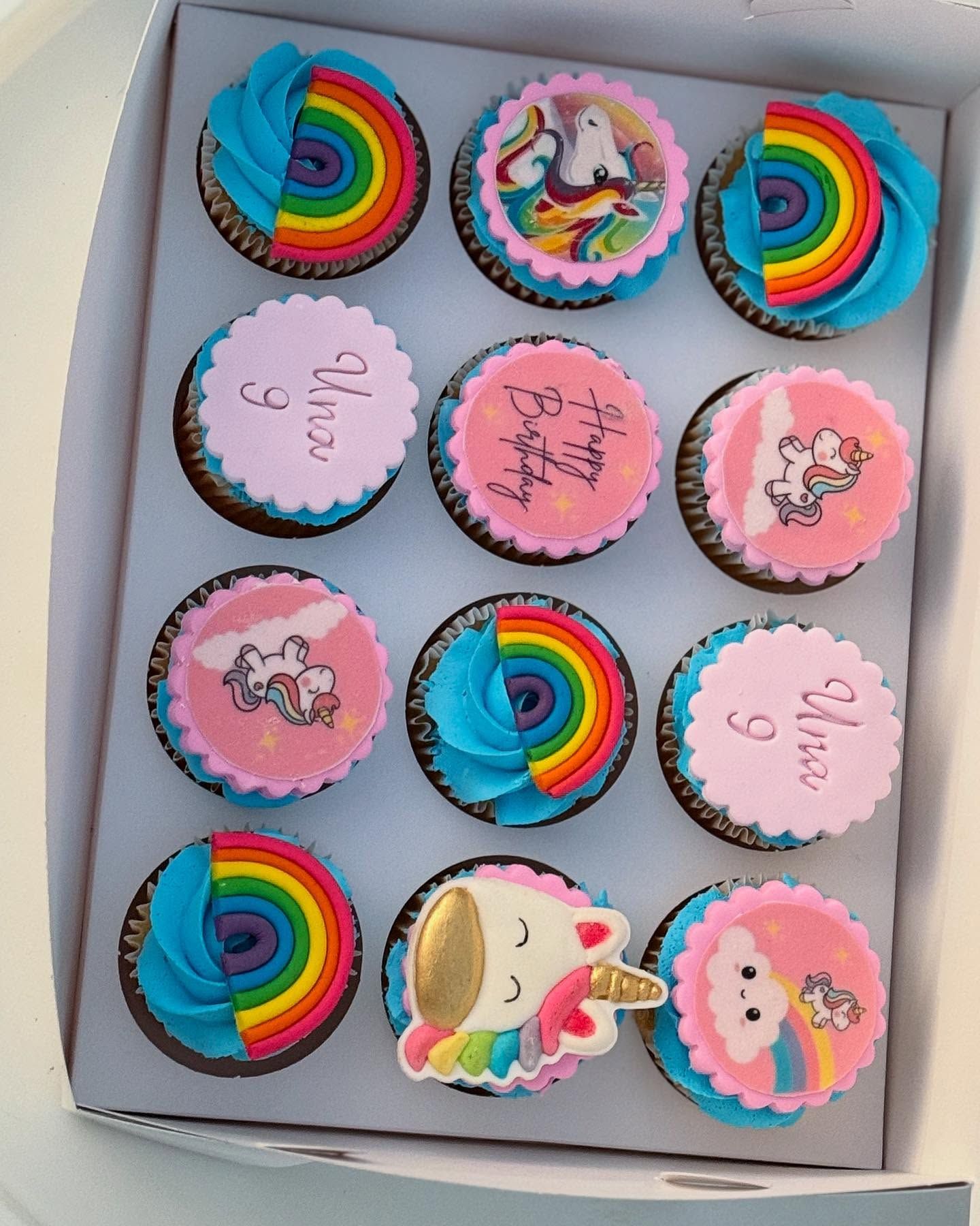 Box of rainbow and unicorn cupcakes